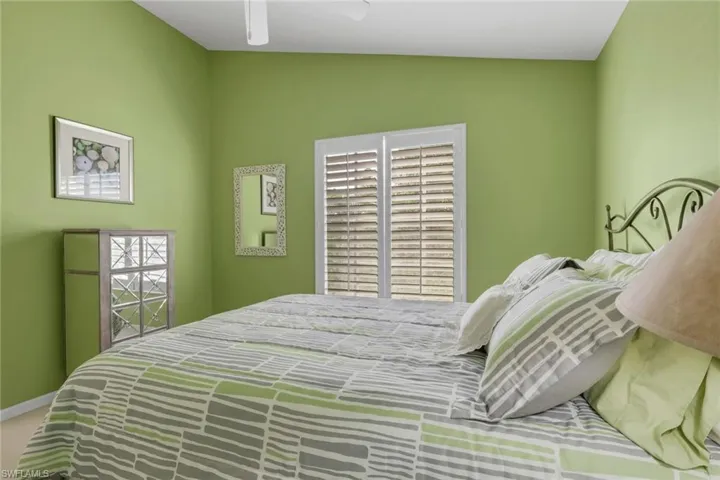 Bedroom featuring plantation shutters