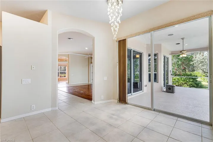 Breakfast Nook with Crystal chandelier and light tile patterned flooring