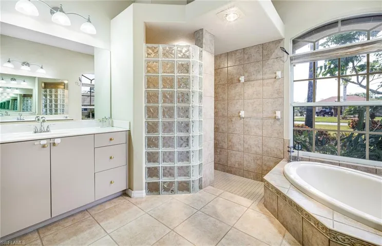Master Bath with dual vanities, and independent shower, soaking bathtub and private water closet