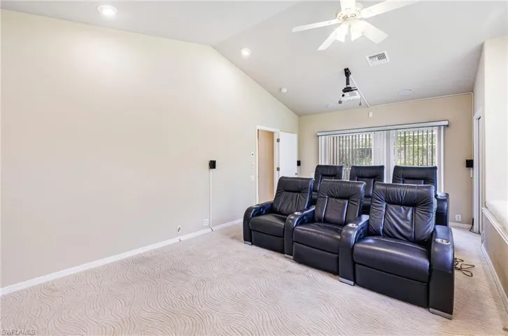 5th Bedroom being used as a media room,120" Projection, Surround Sound, Leather seats, vaulted ceiling, and ceiling fan. latge bay window and window seat too
