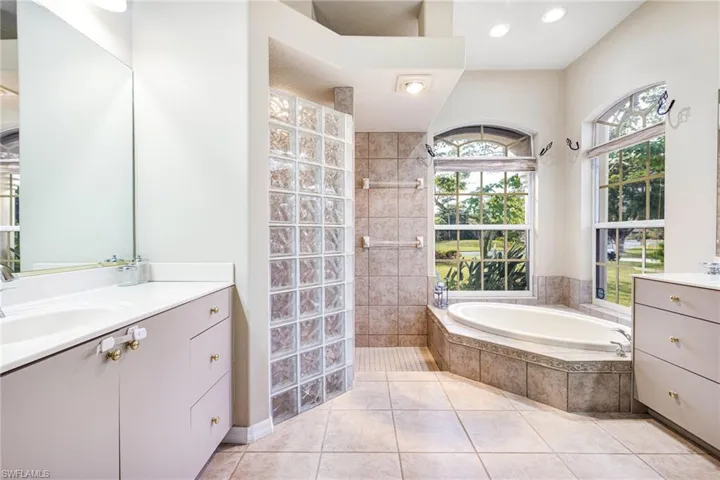 Master Bath with dual vanities, and independent shower, soaking bathtub and private water closet