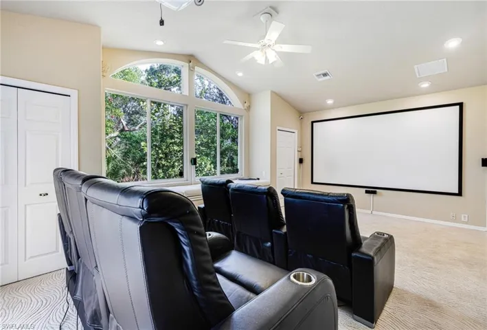 5th Bedroom being used as a media room,120" Projection, Surround Sound, Leather seats, vaulted ceiling, and ceiling fan. latge bay window and window seat too