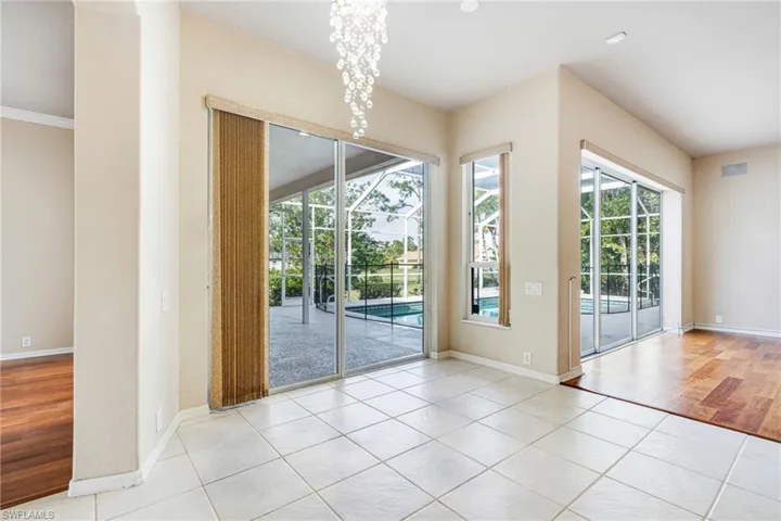 Breakfast Nook with Crystal chandelier and light tile patterned flooring