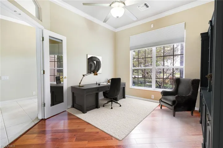 Home office  (Virtually Staged) featuring ornamental molding, hardwood / wood-style floors, and ceiling fan