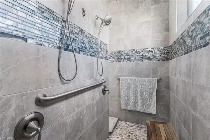 Primary bathroom with walk-thru shower.