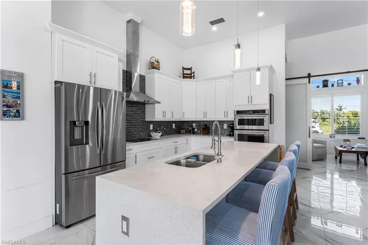 Gourmet kitchen with stainless steel appliances.