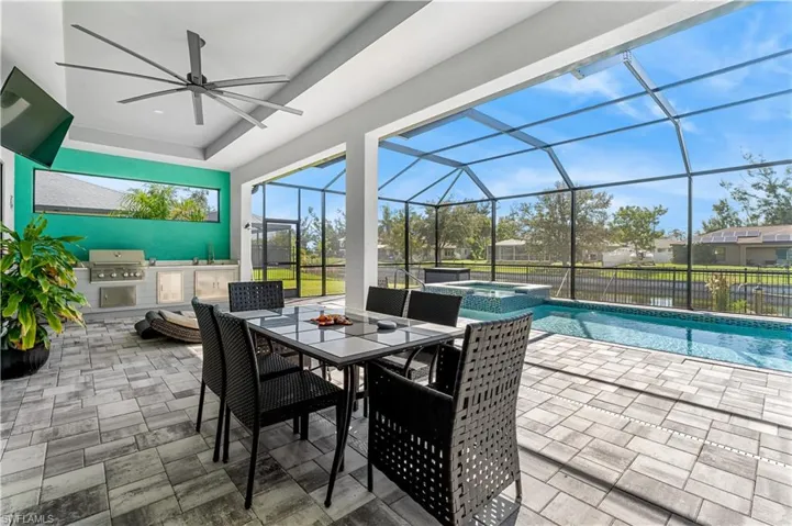 Outdoor dining, overlooking pool, spa and canal.
