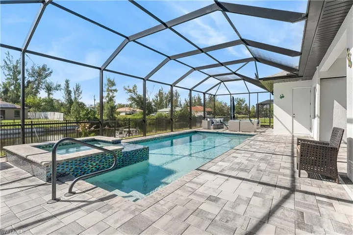 Gorgeous lanai area with amazing view of pool, lanai and canal.