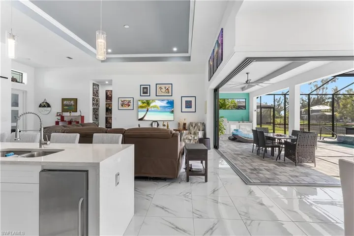 Bring your entertaining space to a whole new level with this 90-degree door expanding your living room into the lanai and patio area.