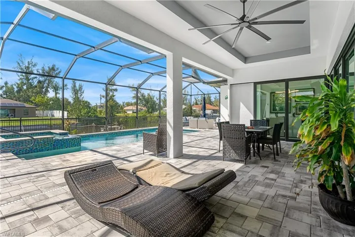 Gorgeous lanai area overlooking pool, spa and canal.