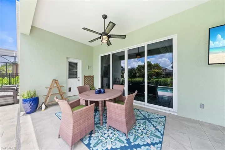 View of patio featuring ceiling fan