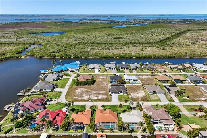 Aerial view of residential area with a nearby body of water