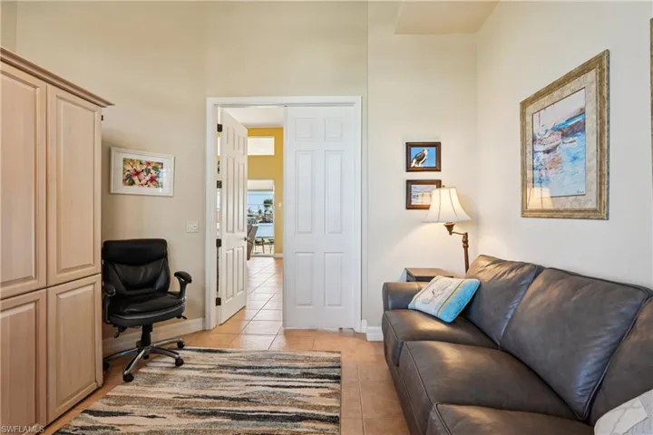 Office area with light tile patterned floors and baseboards