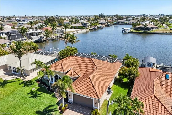 Aerial view of residential area with a nearby body of water