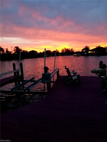 Dock featuring a water view and boat lift