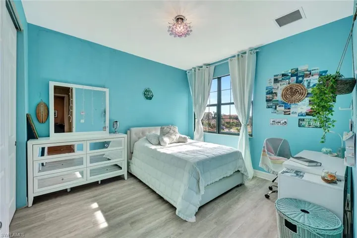 Bedroom with wood-type flooring