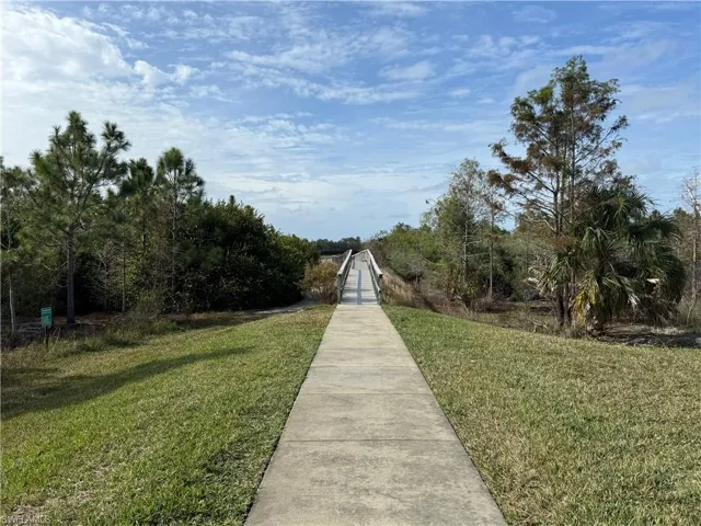 View of walking path and bridge to community center.