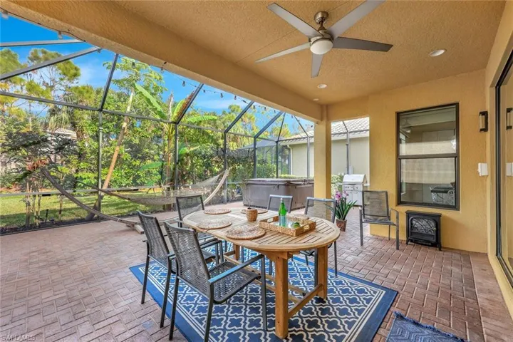 Sunroom / solarium featuring ceiling fan