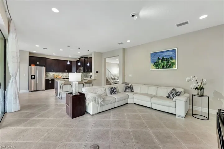 Open-concept floor plan with contemporary finishes, connecting the living, dining, and kitchen areas for effortless entertaining and everyday living