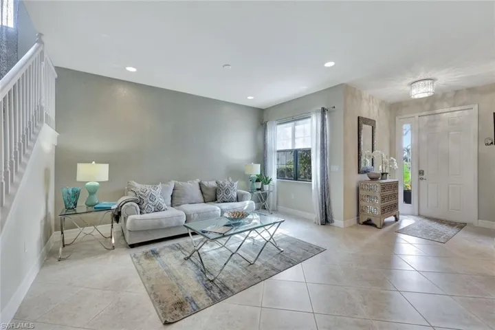 Upon entering this stunning home, you’re greeted by two beautifully designed living spaces that balance elegance and comfort. The formal living area, with expansive windows and an open layout, is perfect for hosting guests or quiet moments. Adjacent is the casual living area, ideal for relaxation and family gatherings, seamlessly connected to the kitchen and outdoor spaces. Both rooms are bathed in natural light, creating a warm and inviting atmosphere