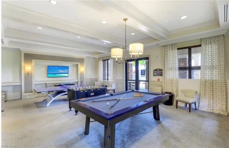 Playroom featuring billiards, crown molding, beam ceiling, and carpet flooring