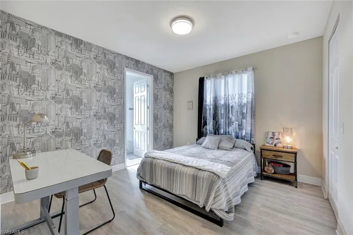 Bedroom with light hardwood / wood-style floors