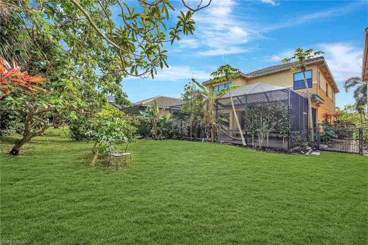 View of yard featuring lanai enclosure