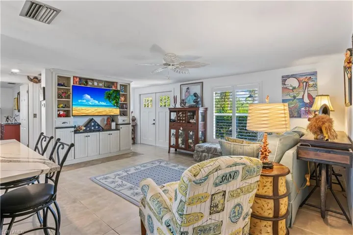 Foyer opening to a spacious living area, offering comfort, elegance, and a Florida waterfront feel.