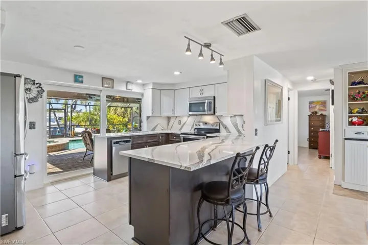 Kitchen designed for style and function, combining luxury finishes with practical layout.