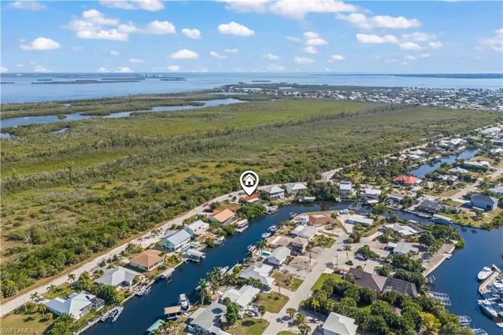 Drone shot capturing the beauty of this Florida retreat as the sun sets over the expansive Gulf waters.