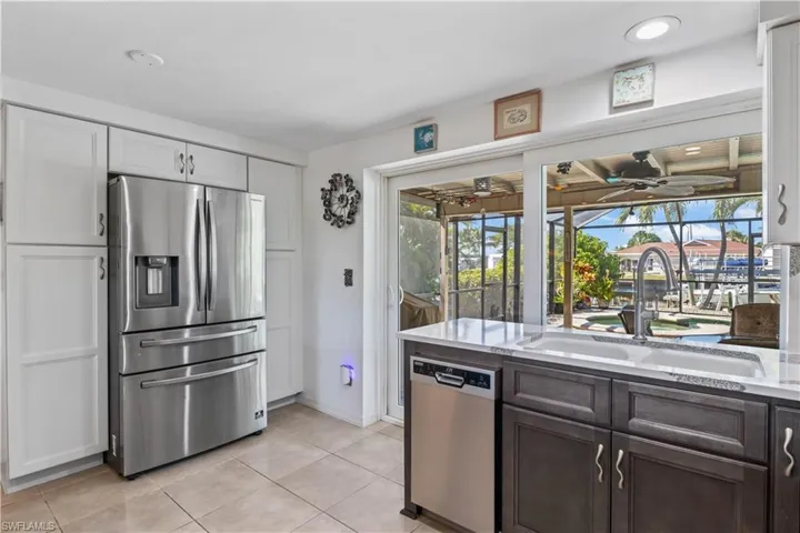 Modern kitchen with solid wood cabinets, pull-out drawers, and all-new appliances for effortless cooking.