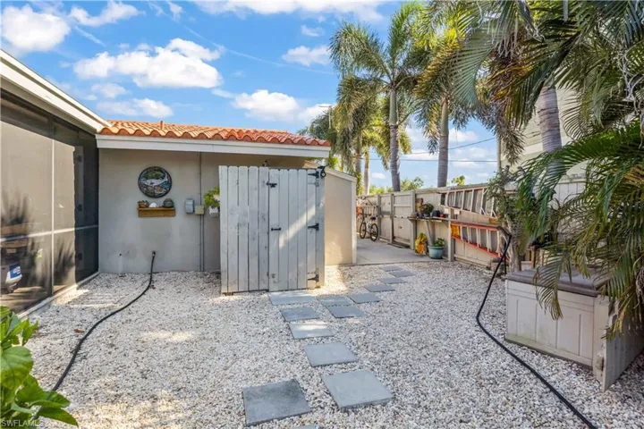 Motorhome hookup and covered lift area provide flexibility for vehicles and watercraft, enhancing waterfront convenience.