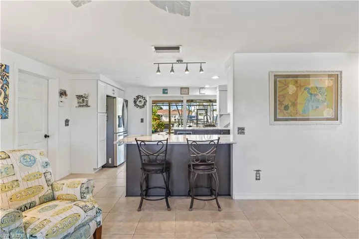 Fully remodeled kitchen with breakfast bar, ideal for entertaining or family meals.