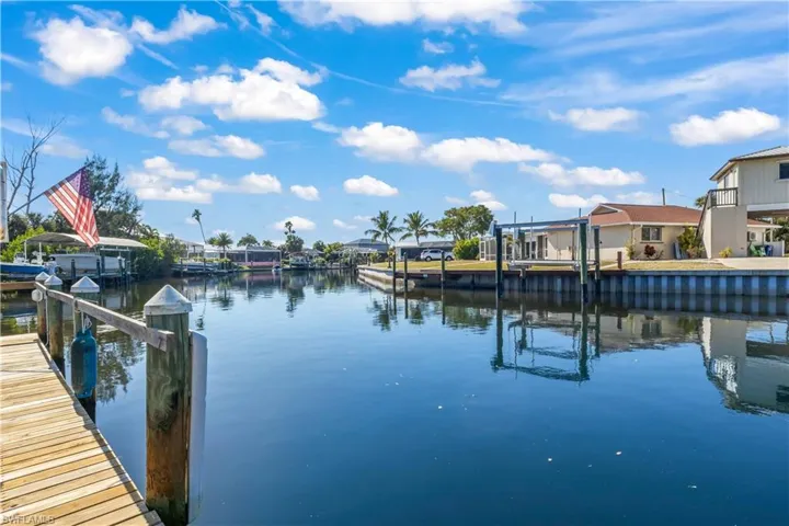 Private dock with captain’s walk and covered lift, offering effortless access to the open water.