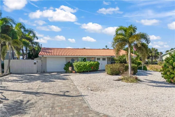 Charming entrance to a fully remodeled waterfront residence, combining style and curb appeal.