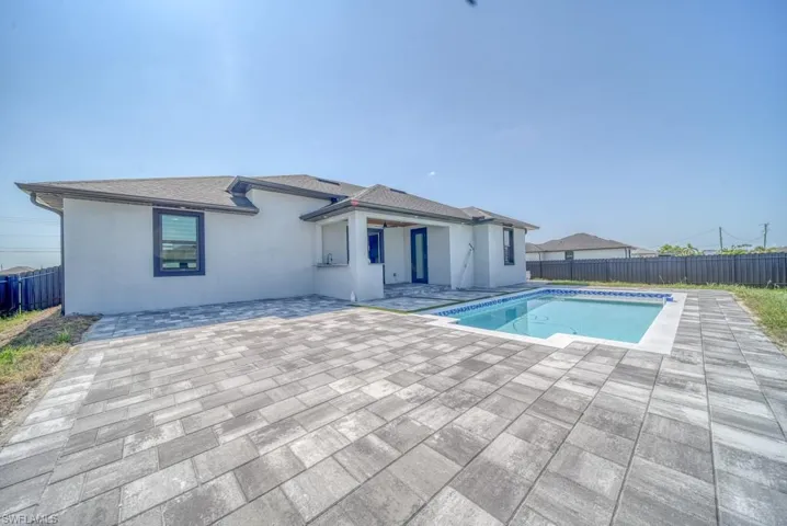 View of pool featuring a patio and a fenced backyard