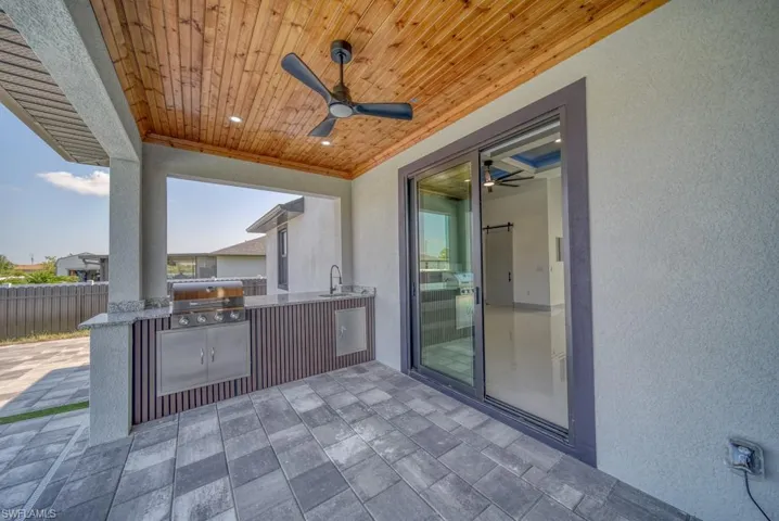 View of patio / terrace with a sink and a ceiling fan