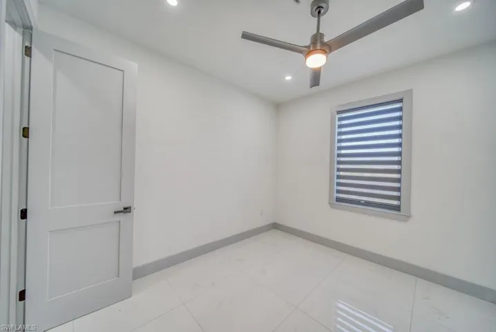 Spare room featuring ceiling fan, baseboards, and recessed lighting