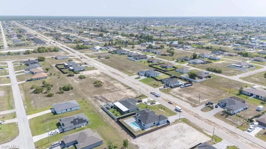 Aerial overview of property's location with nearby suburban area