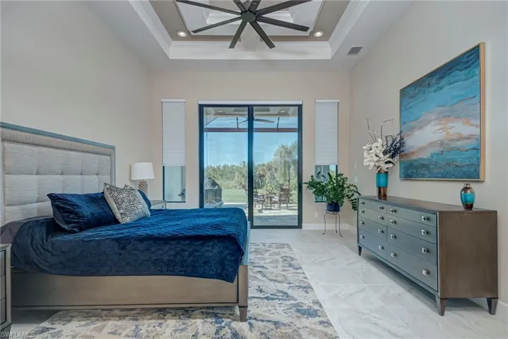 Bedroom with access to outside, ceiling fan, recessed lighting, and a raised ceiling