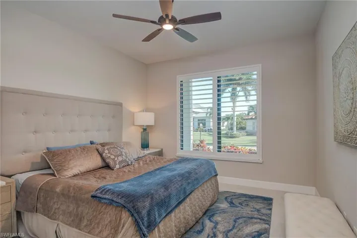 Bedroom featuring baseboards and ceiling fan