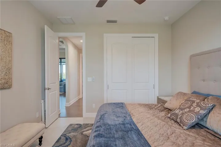 Bedroom featuring a closet, ceiling fan, and recessed lighting