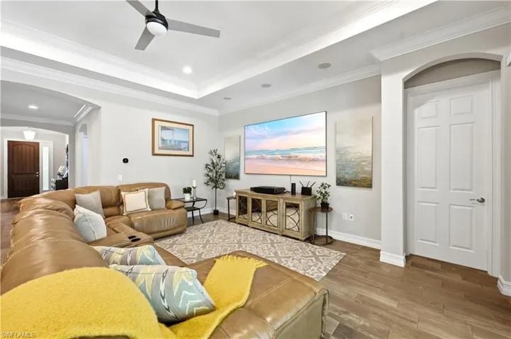 Living Room with ceiling fan and wood flooring