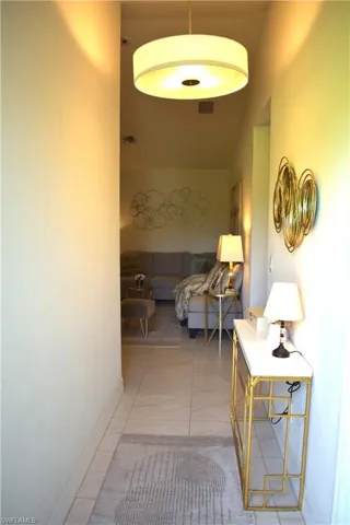 Hall with tile patterned flooring