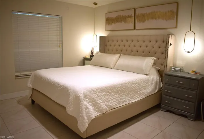 Bedroom featuring light tile patterned flooring