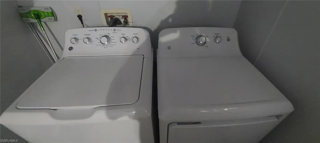 Laundry area featuring washer and clothes dryer