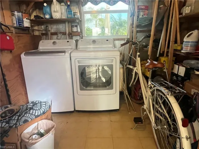 Laundry area with washer and clothes dryer