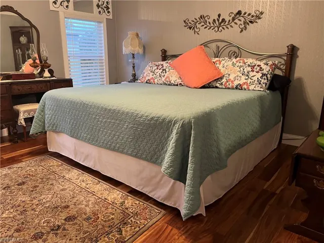 Bedroom featuring wood-type flooring