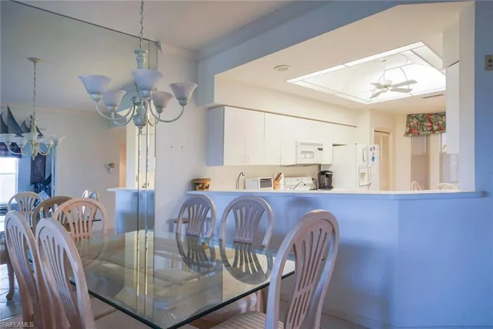 Dining area with ornamental molding and ceiling fan