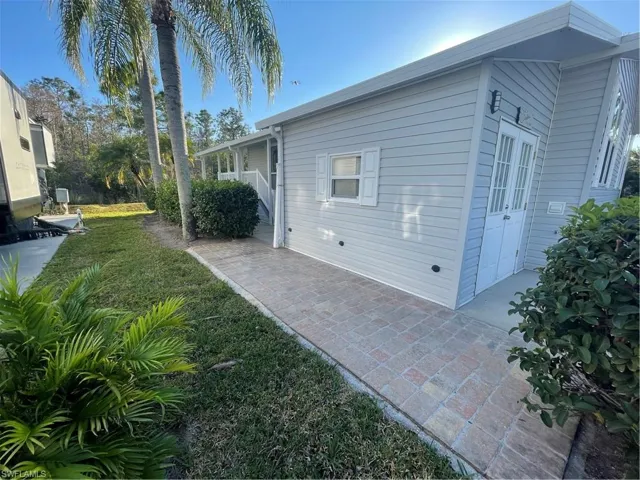 View of home's exterior featuring a lawn